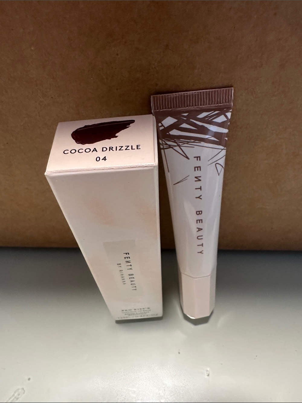 Fenty Beauty Cocoa Drizzle Lip Gloss —